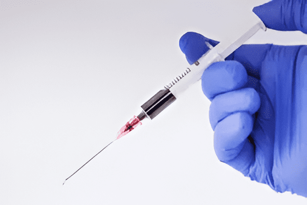 Medical syringe with red liquid